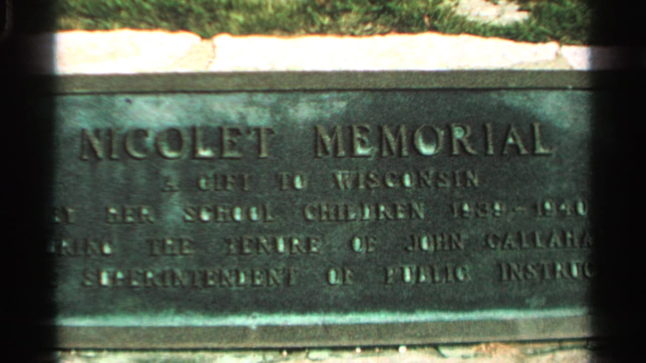 Close-up of the Nicolet Memorial plaque on Washington Island, Wisconsin, in 1964 8mm home-movie footage.