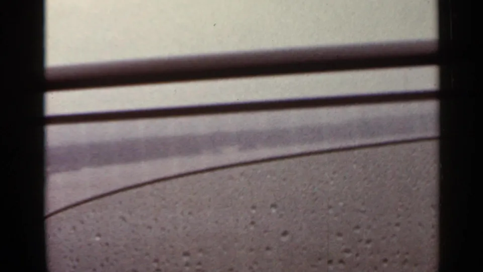 1965 Arkansas 8mm view along bridge railings and roadway surface from inside a moving vehicle.