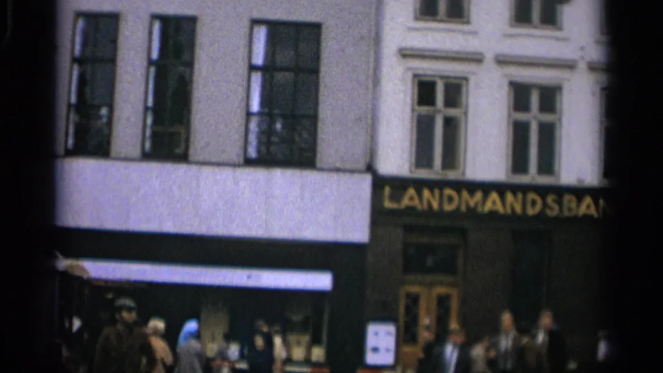 1965 Copenhagen street view of the Landmandsbanken frontage with pedestrians moving below the upper windows.