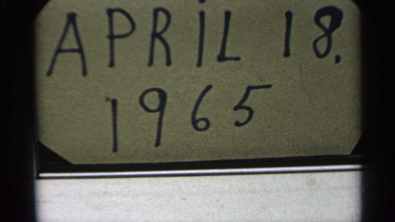Handwritten April 18, 1965 card with a dim water landscape below.