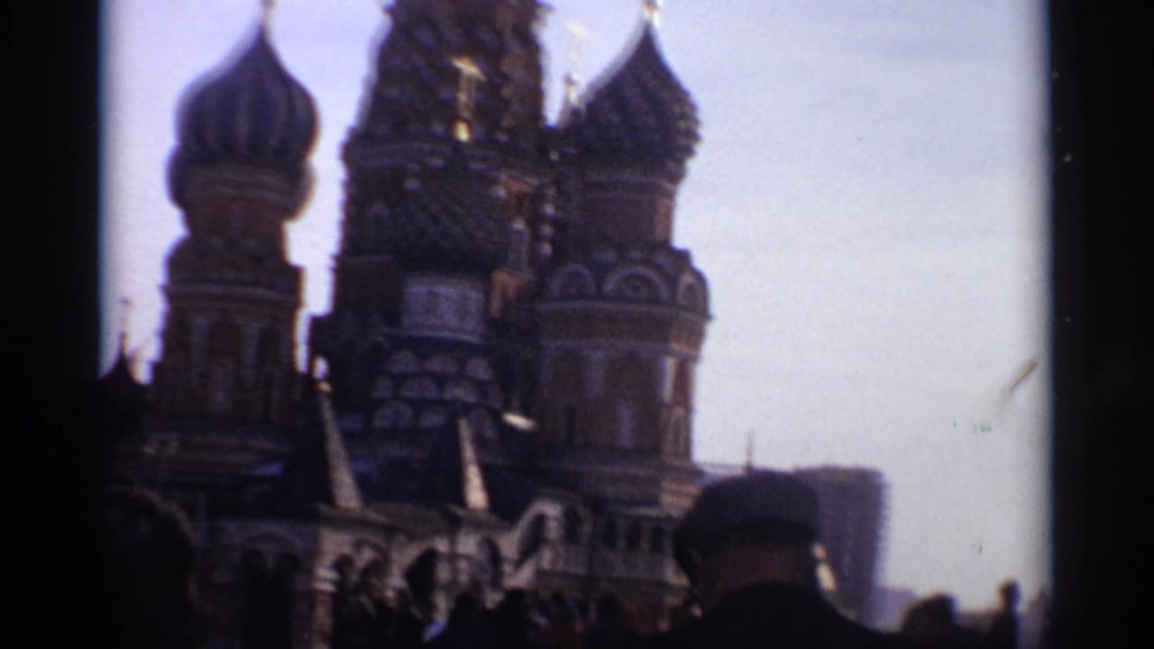 St. Basil's Cathedral partly framed by dark film edges with visitors in the foreground.