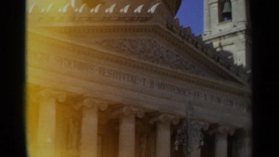 1965 Tangier frame holding on the classical facade, with columns, carved ornament, and visible Latin inscription.