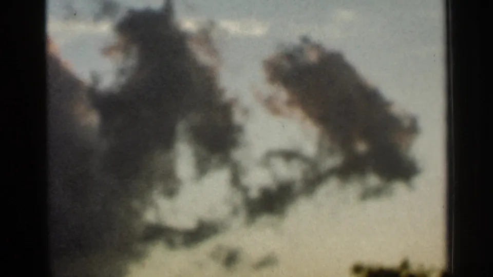 Archival 8mm still from Hamel, Minnesota showing stratus-like cloud forms across a softly exposed sky.