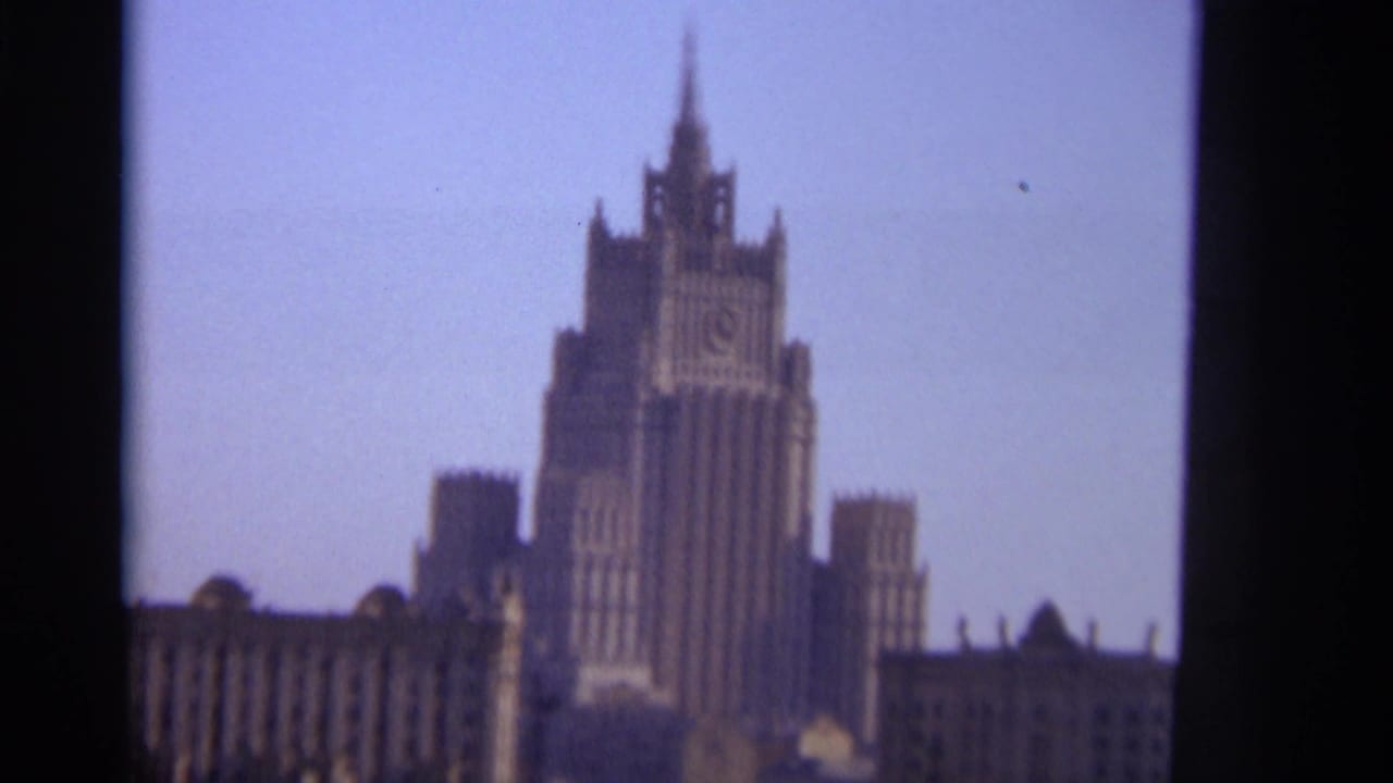 Soft 8mm view of a tall spired Moscow building against a pale sky.