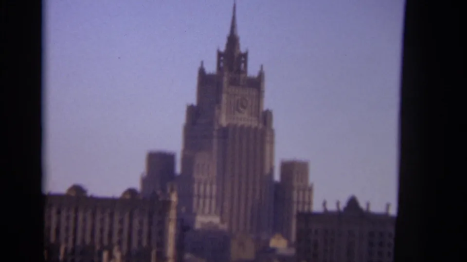 1966 Moscow home-movie still showing the Ministry of Foreign Affairs building in a slightly blurred handheld frame.