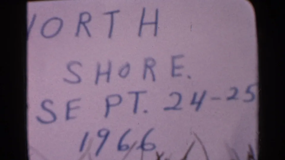 1966 8mm home-movie title card with handwritten North Shore text and segment notes, associated with the Wauseon, Ohio clip metadata.