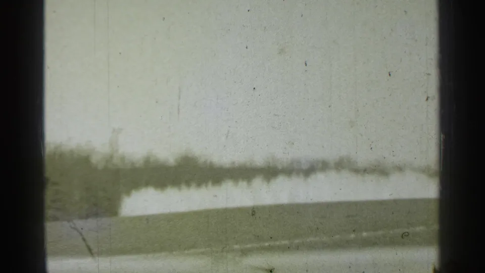 Danielson, Connecticut 1939 8mm frame showing a soft exterior landscape or building view before the pharmacy interior appears.