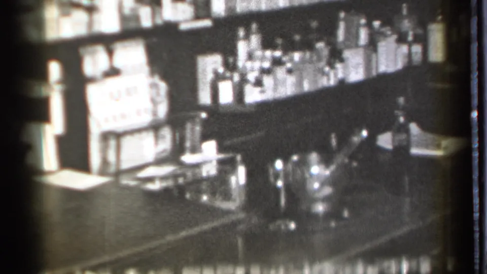 Danielson, Connecticut pharmacy interior from 1939, showing shelves of bottles and a counter area in soft 8mm black-and-white footage.