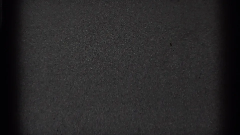 Metadata-supported 1944 San Francisco 8mm frame with a mostly blank dark title-card field, grain, and vertical film edge shadows.