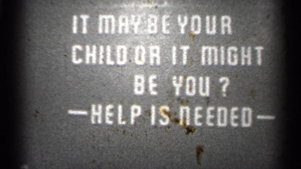 1944 metadata-supported San Francisco 8mm frame showing a white text warning card asking if help is needed.