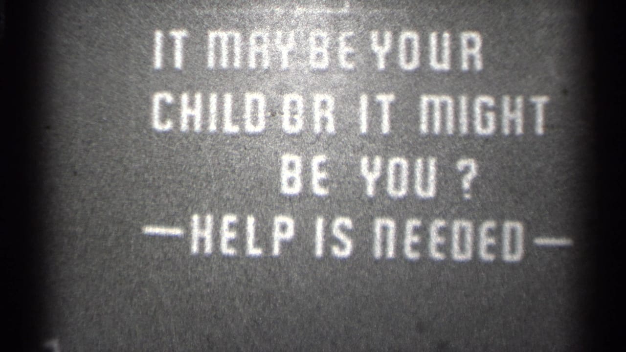 White warning text remains centered against a dark background.