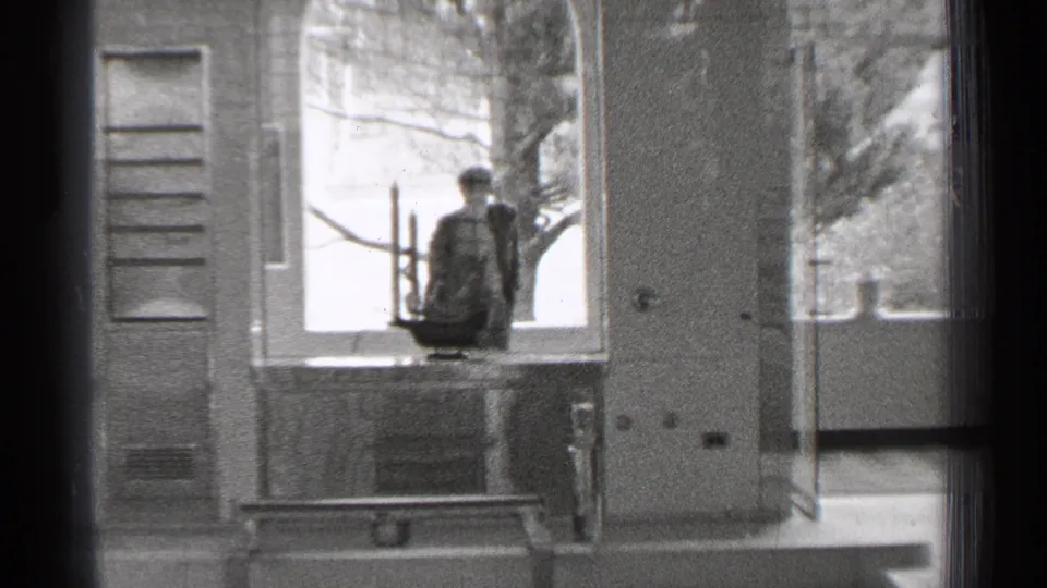 A San Francisco window view shows shutters, a ledge, a candelabra-like display object, and trees beyond.