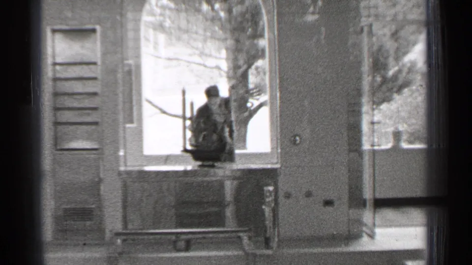 A 1944 San Francisco interior-facing shot frames a window ledge, shutters, doorway, and small display object.