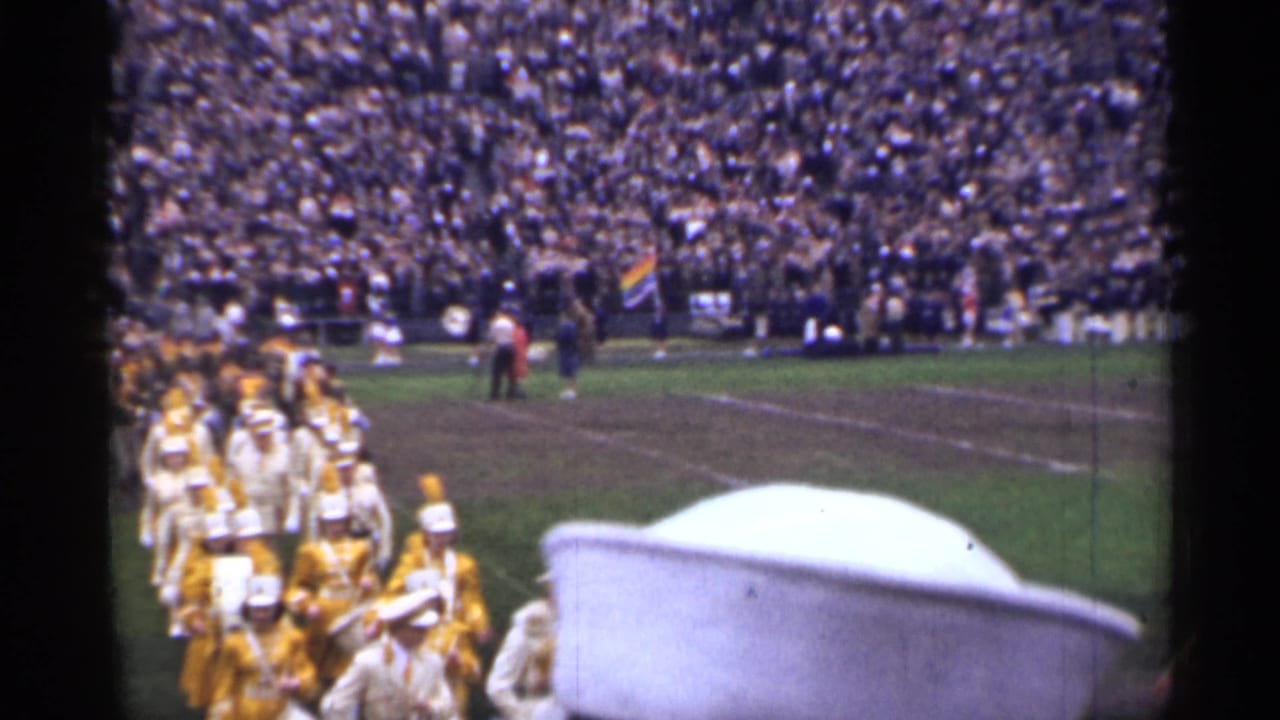 1944 San Francisco stadium view with a marching band moving in formation across the football field from a spectator viewpoint.
