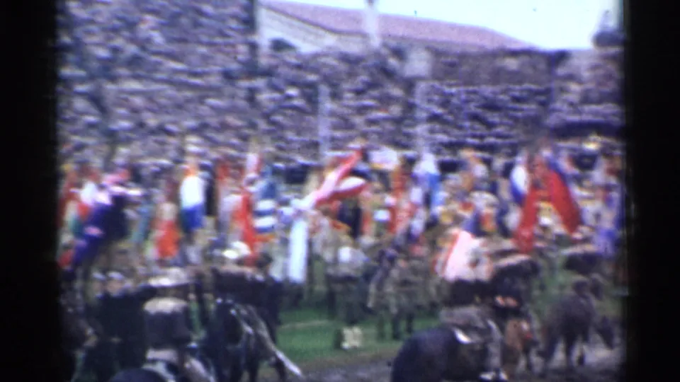 1944 San Francisco stadium view with flag bearers and people moving across the football field before a large crowd.