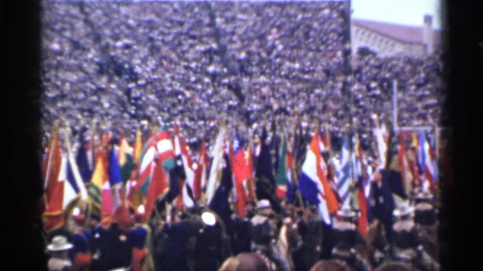 San Francisco 1944 home-movie view of flag bearers and a large grandstand crowd during a stadium ceremony.