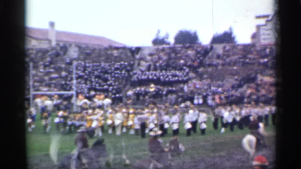 A wide 1944 San Francisco stadium view shows musicians in formation, mounted participants, a full crowd, and part of a scoreboard at the edge.