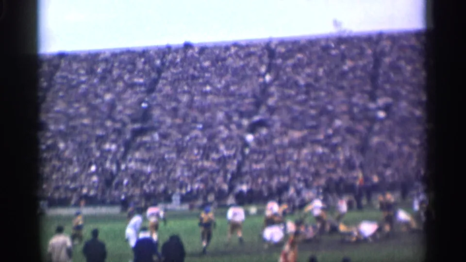 End of a 1944 San Francisco college football play, with players separating on the field and the grandstand still in view.