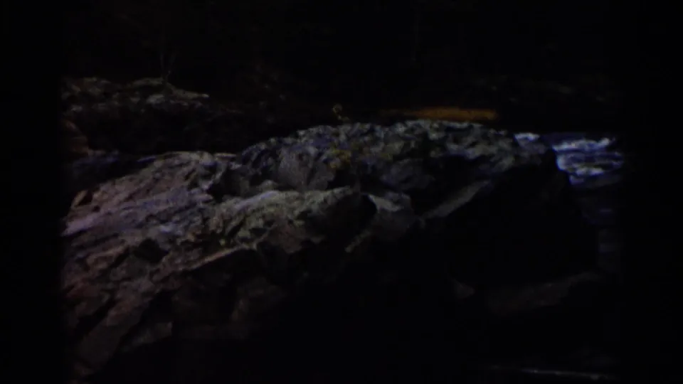 A dim final frame shows a rocky textured surface in low light, with surrounding areas falling into shadow.
