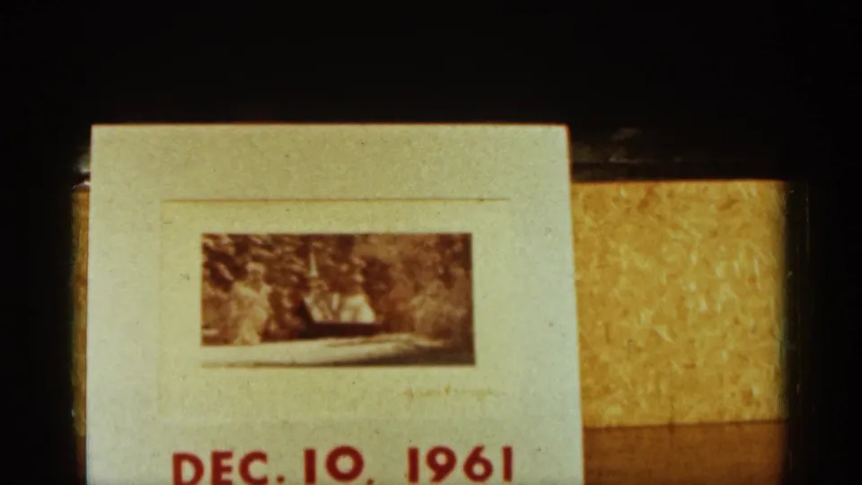 Final 8mm frame shows a hand-dated card reading DEC. 10, 1961, with a small mounted photo on a tabletop.
