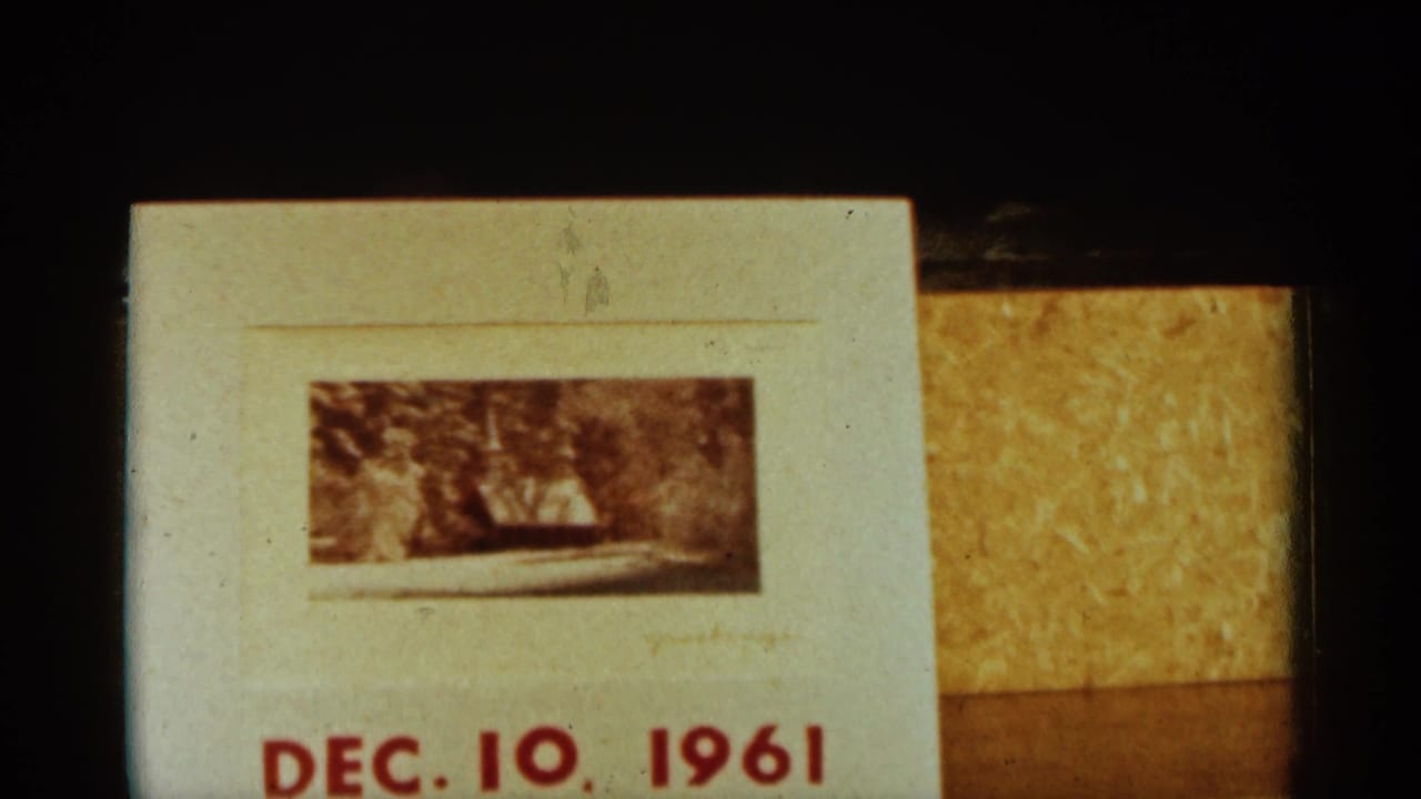 Minnesota 1961 home-movie title card with red Dec. 10, 1961 lettering and a small snowy scene above it.
