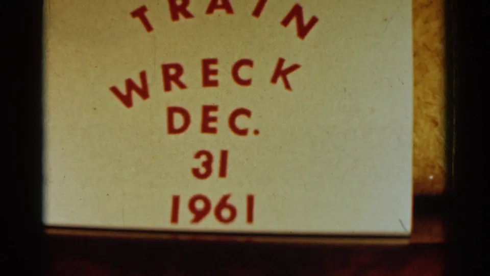 End title card in the 8mm reel reads "TRAIN WRECK DEC. 31 1961" in red letters on a pale background.