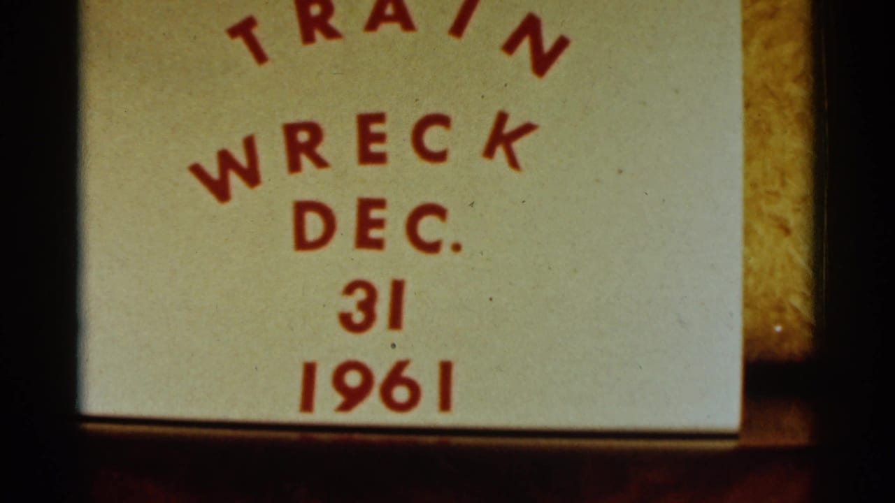 1961 8mm frame showing a handwritten or printed label reading Train Wreck Dec. 31 1961, photographed before the Bird Island winter scene.