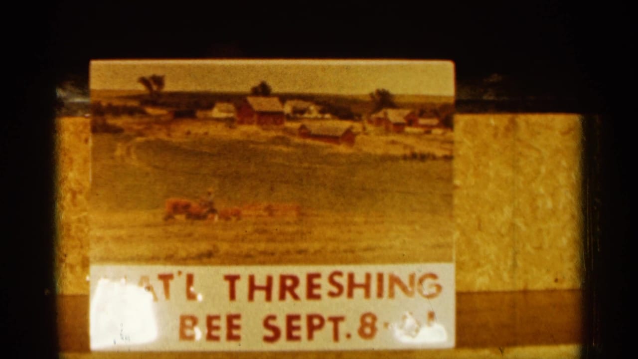 Title card showing a farm painting and partial text for a threshing bee dated Sept. 8.