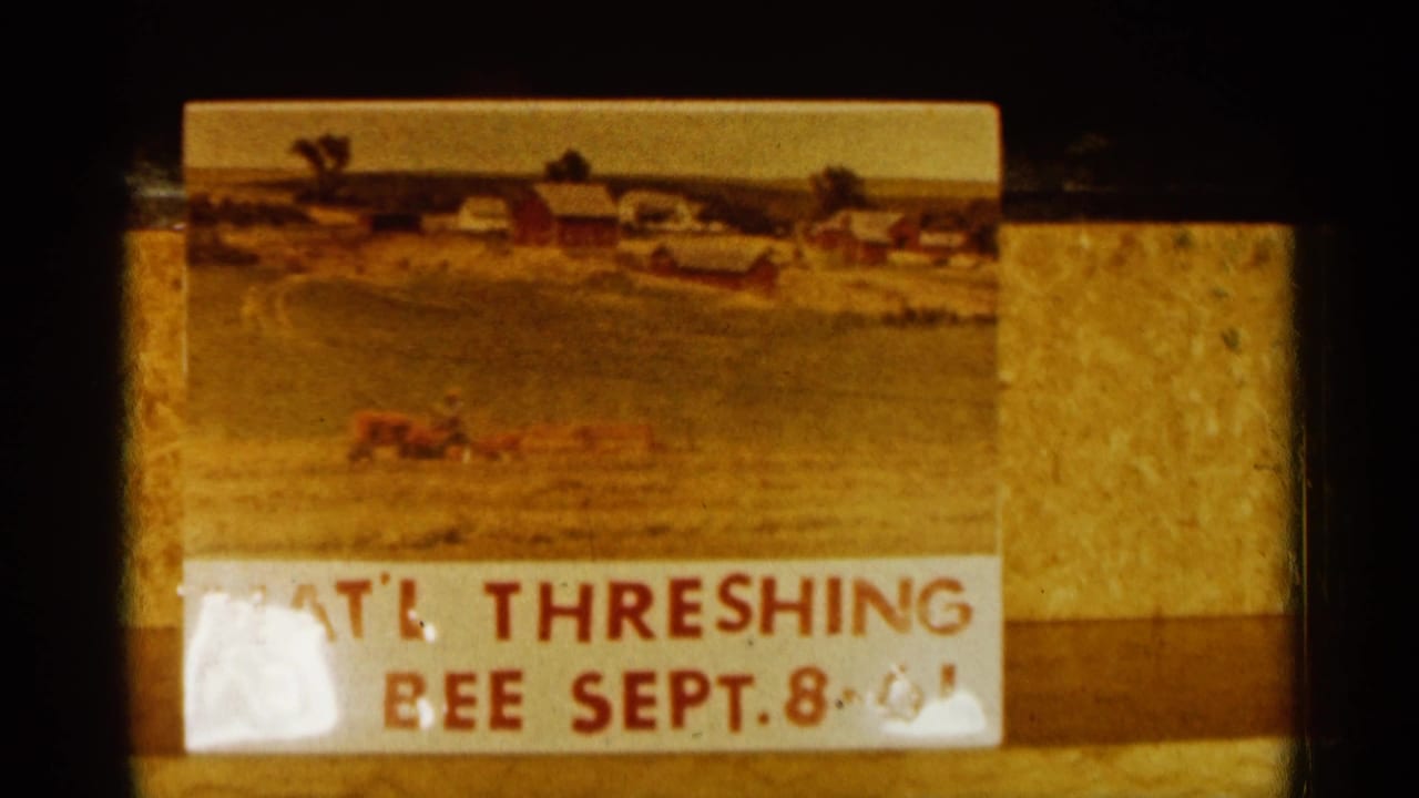 Similar title card with farm painting and clearer threshing bee lettering.