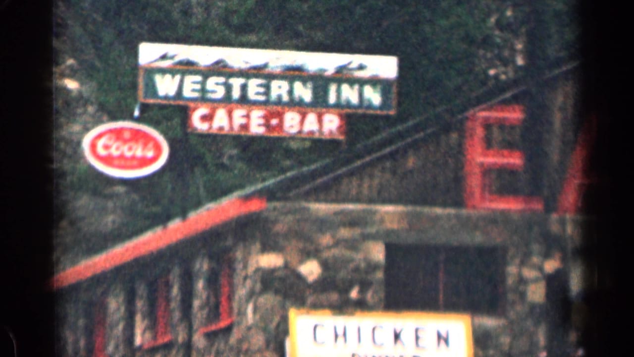 Roadside Western Inn cafe-bar sign with a visible Coors logo.