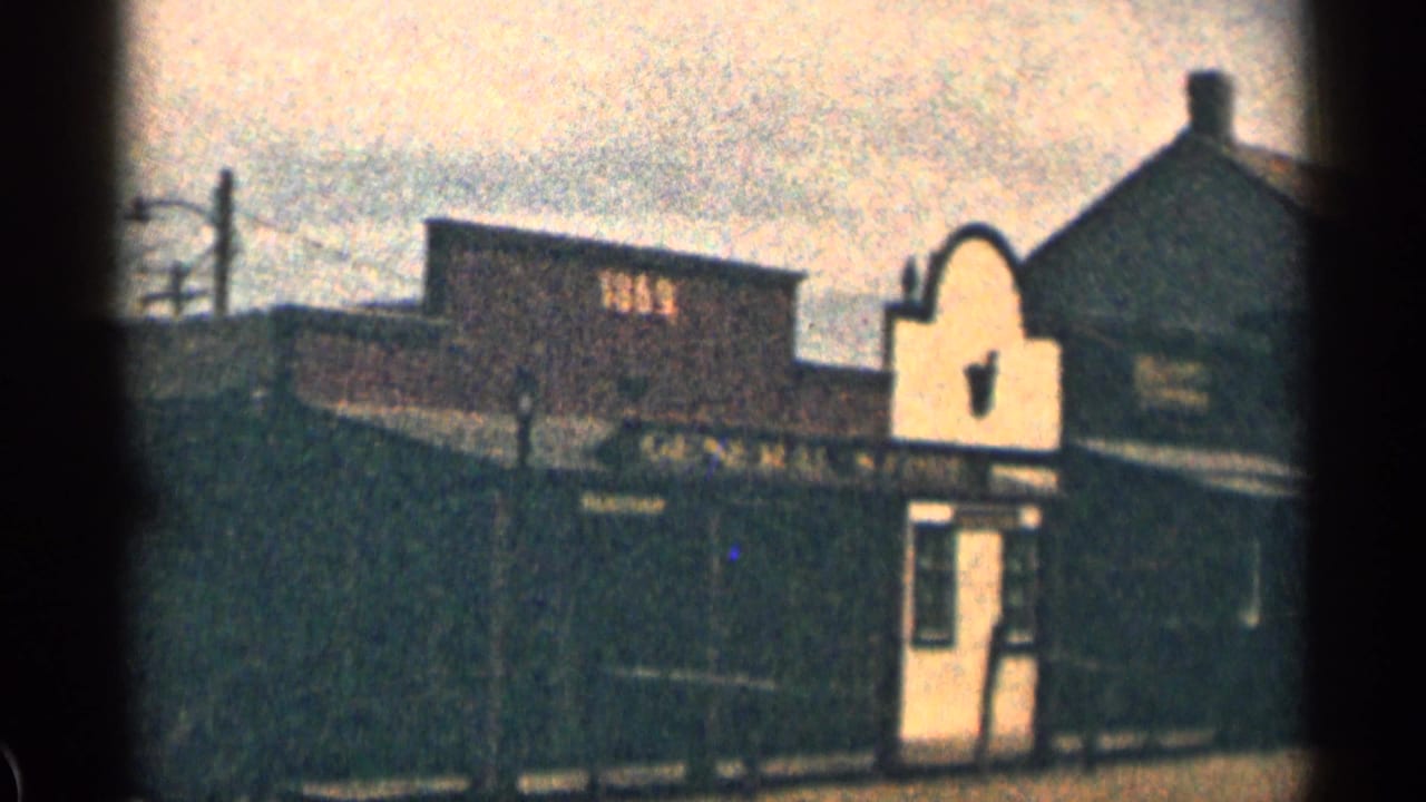 General Store and neighboring hotel storefronts seen from across a quiet street.