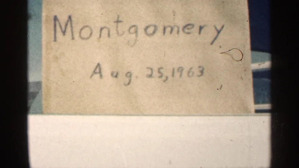 Centered handwritten Montgomery label dated Aug. 25, 1963 on aged paper, with visible dust and 8mm film borders.