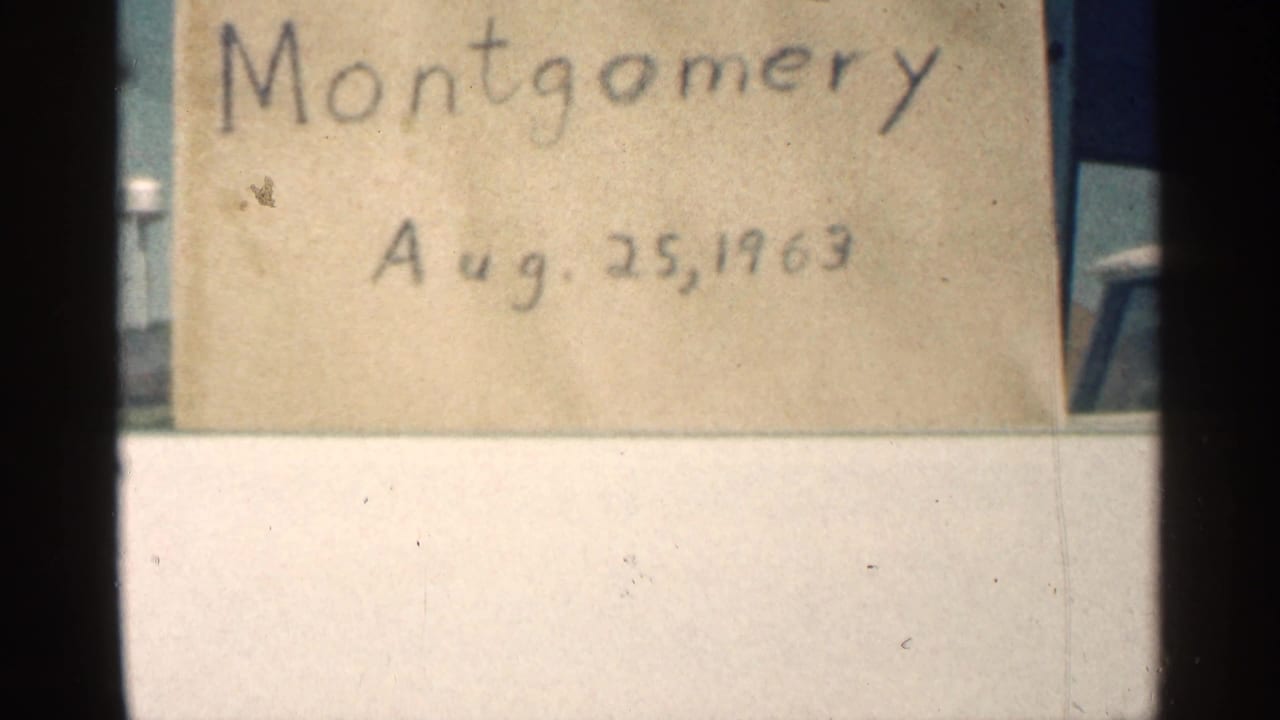 Montgomery, Minnesota home-movie title card dated Aug. 25, 1963, seen close up with 8mm frame edges.
