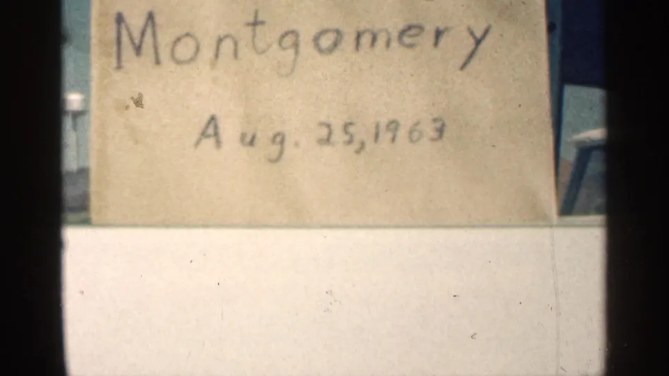 Montgomery, Minnesota home-movie title card dated Aug. 25, 1963, seen close up with 8mm frame edges.