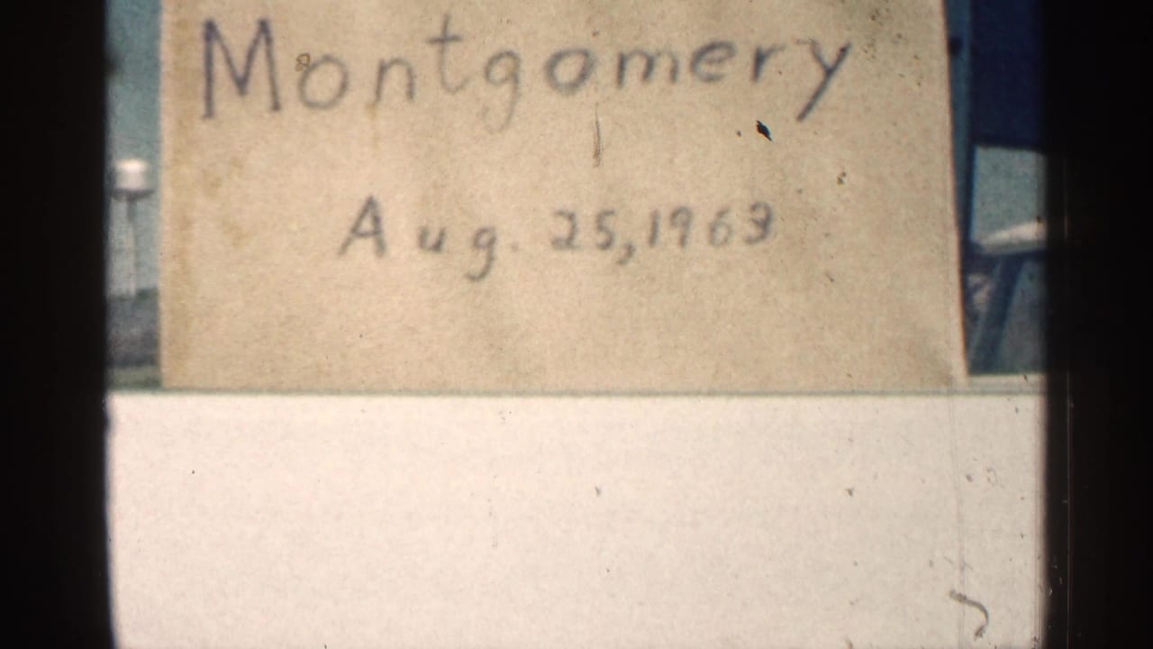 Second view of the handwritten Montgomery date card inside the film frame.