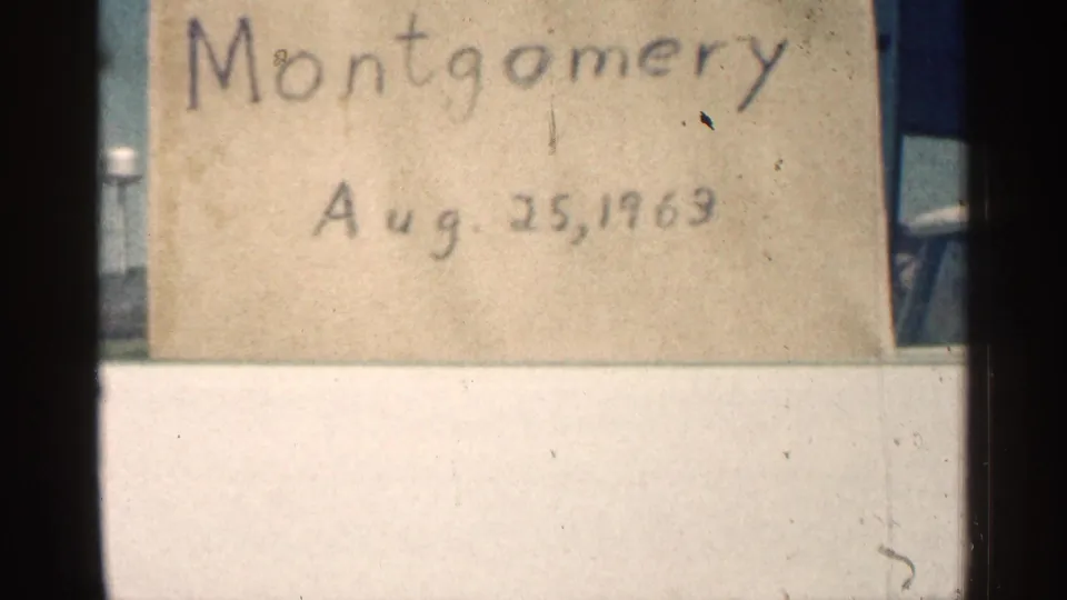 Close view of the handwritten Montgomery card dated Aug. 25, 1963, with slight exposure variation and film wear.