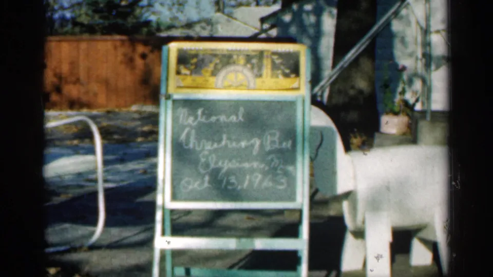 A handwritten slate appears in the 1963 home movie, marking the Montgomery, Minnesota harvest footage.