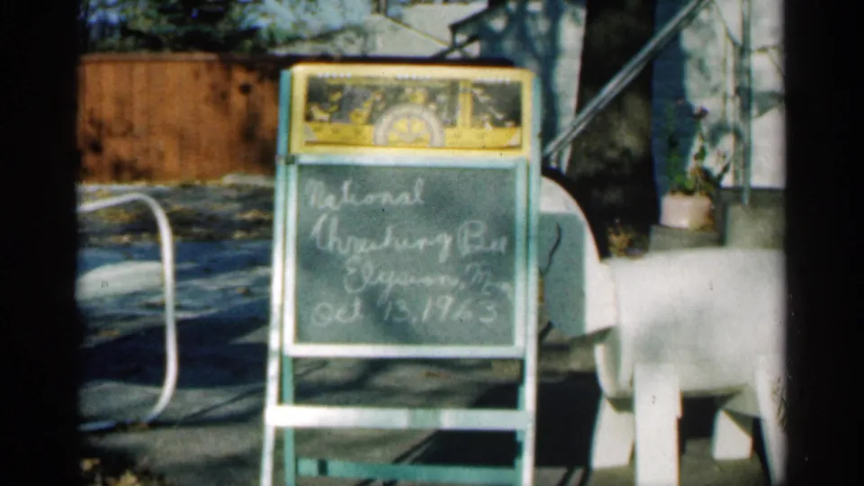 The slate remains in view with handwritten text connected to the 1963 Montgomery, Minnesota harvest sequence.