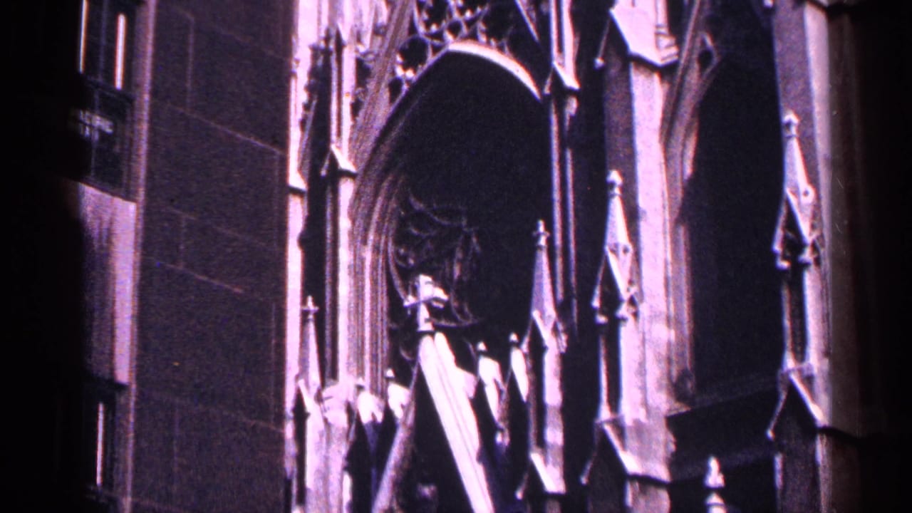 Close view of Gothic-style stone arches and pointed exterior details.