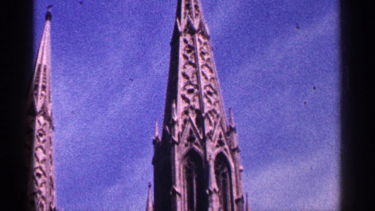 Gothic cathedral spires rising against a blue sky.