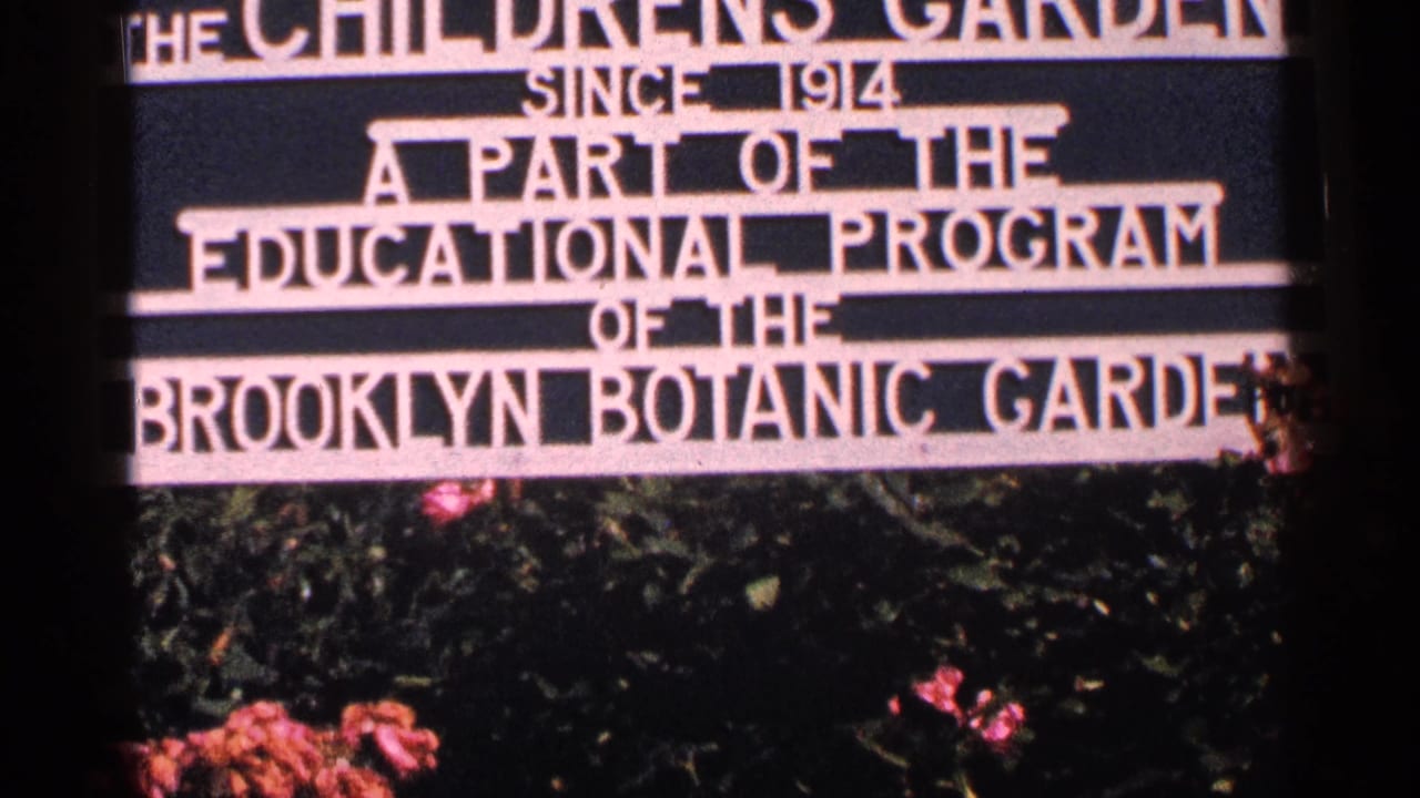 1964 New York footage shows a Children's Garden sign at Brooklyn Botanic Garden with flowers below it.