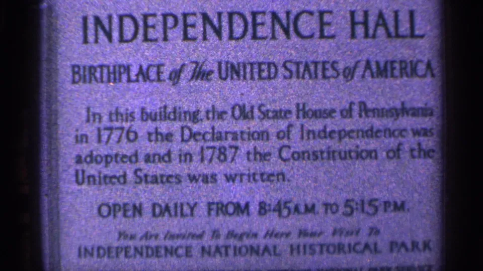 Closer 1960s 8mm view of the Independence Hall marker, including founding-history wording and the Independence National Historical Park line.