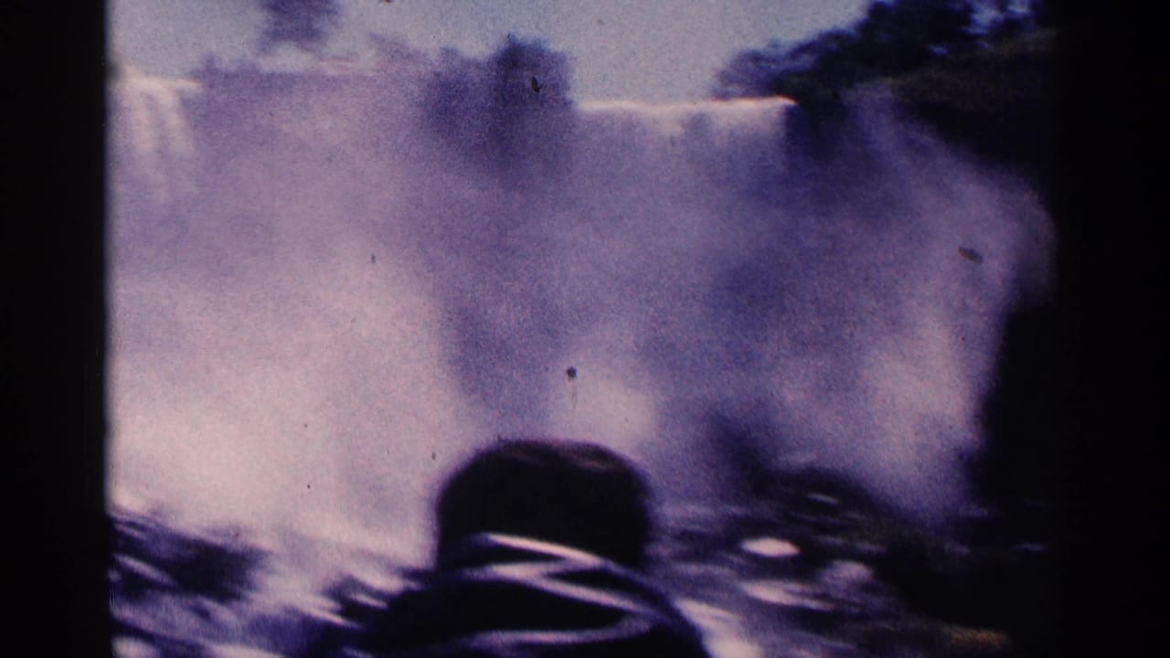 Mist and falling water with a dark foreground observer shape and film border.
