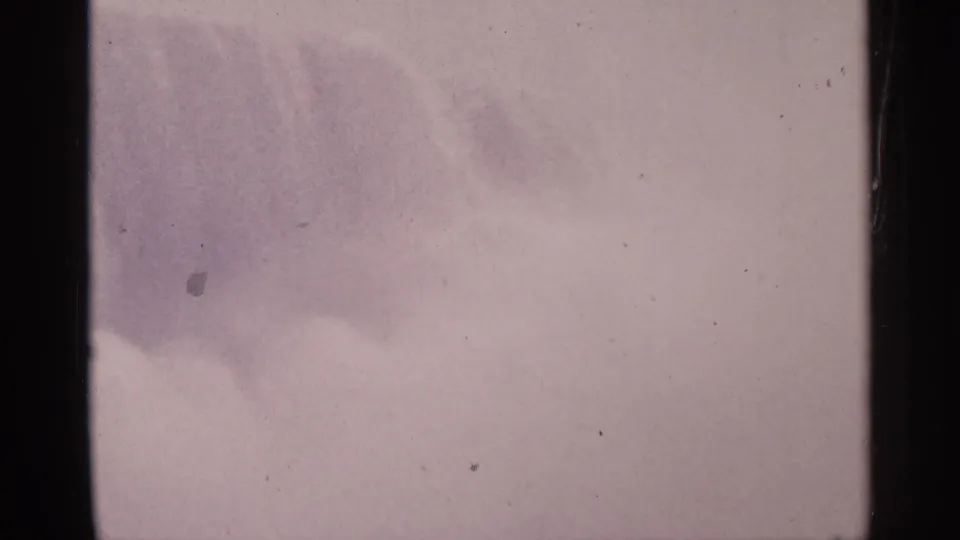 Bright, mist-heavy 1964 8mm view at Niagara Falls, Canada, with waterfall detail partly obscured by spray.