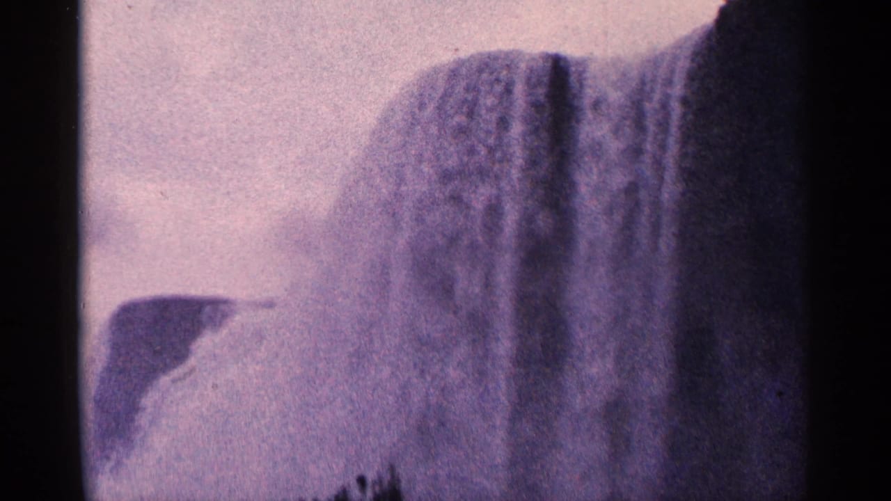 Soft 8mm view of Niagara Falls with mist and dark foreground edges.