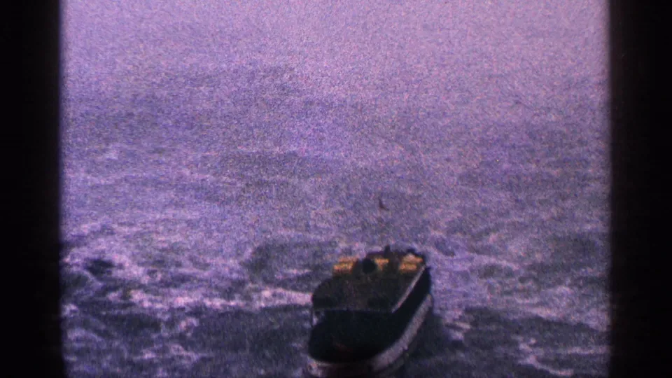 Small passenger boat appears on turbulent grey-blue water in the Niagara Falls listing context, filmed with aged 8mm color and heavy grain.
