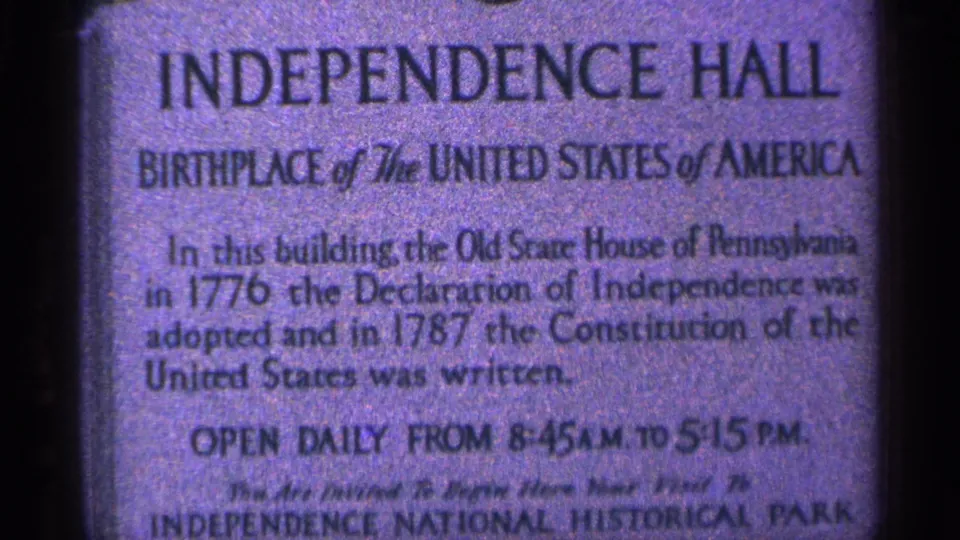 Close 1964 visitor-shot view of the Independence Hall marker, including the heading, founding-era text, hours, and park wording.