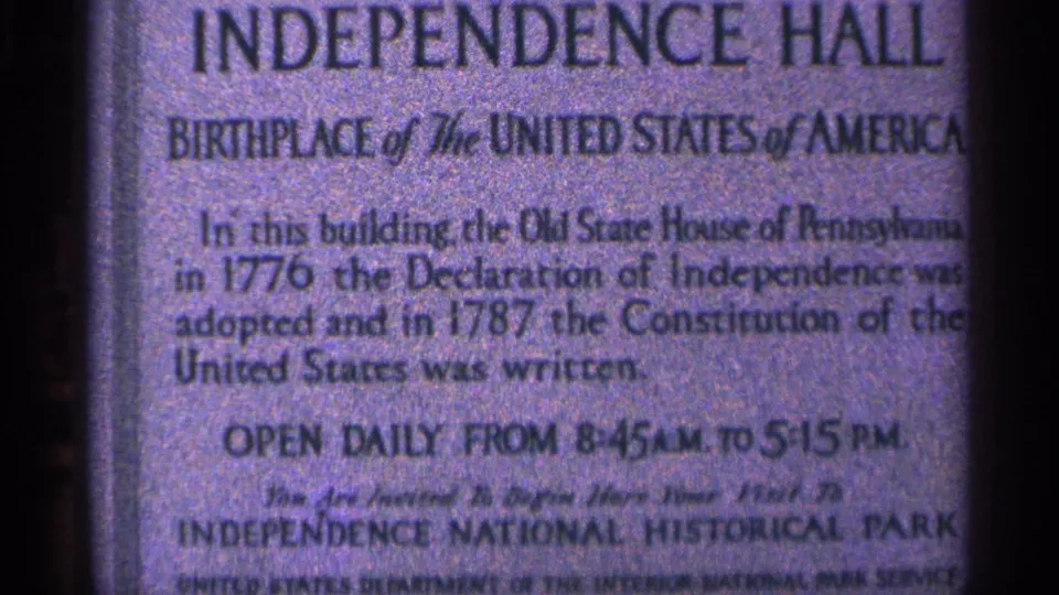 Close 1964 visitor-shot view of the Independence Hall placard, including text about the Declaration of Independence and Constitution.