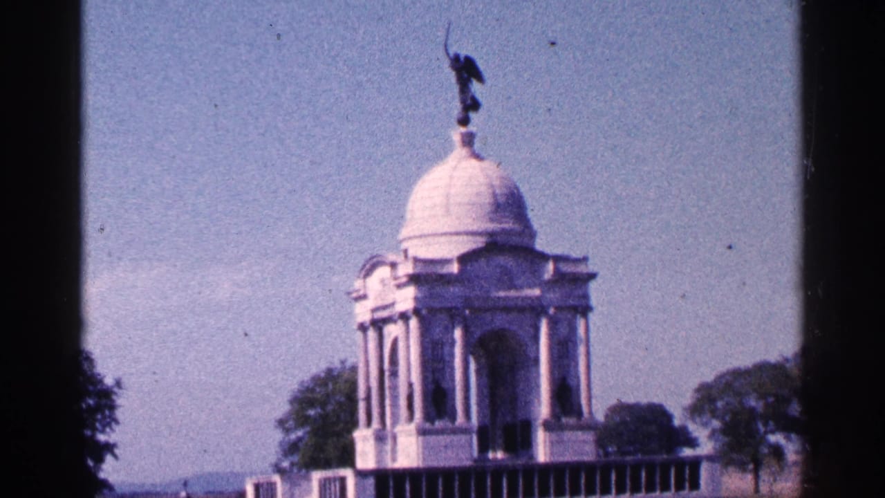 1964 Pennsylvania 8mm frame showing a white domed monument with classical columns, trees, and a dark statue above.