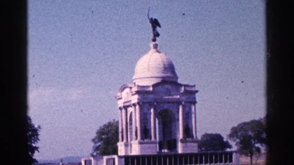 1964 Pennsylvania 8mm frame showing a white domed monument with classical columns, trees, and a dark statue above.